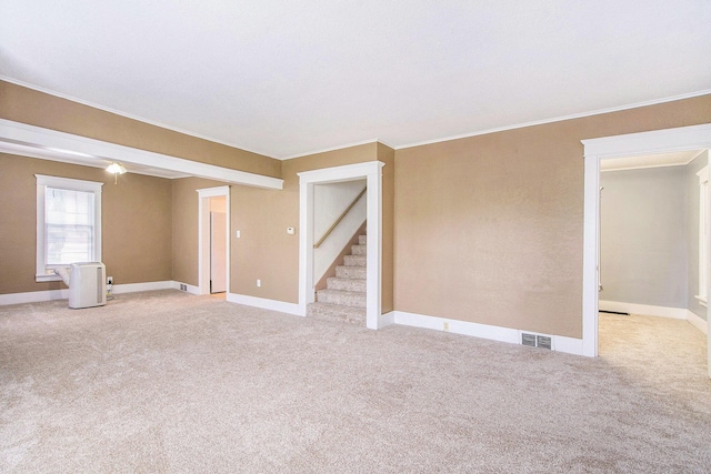 240 Stillwell Ave, Michigan Center, MI 49254 - spare room with light colored carpet, crown molding, and stairs