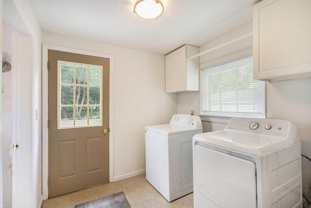240 Stillwell Ave, Michigan Center, MI 49254 - washroom featuring washing machine and clothes dryer, cabinet space, plenty of natural light, and light tile patterned flooring