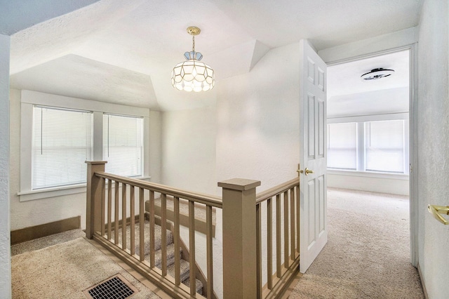240 Stillwell Ave, Michigan Center, MI 49254 - corridor with an upstairs landing, a chandelier, and carpet