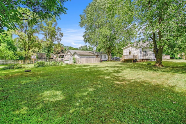 240 Stillwell Ave, Michigan Center, MI 49254 - view of yard with a wooden deck