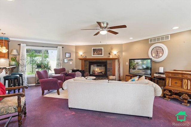 2340 Lakeview Dr, Brooklyn, MI 49230 - living area with dark colored carpet, crown molding, ceiling fan, a tile fireplace, and recessed lighting