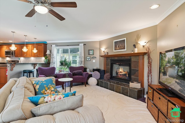 2340 Lakeview Dr, Brooklyn, MI 49230 - living room featuring a tile fireplace, crown molding, recessed lighting, and a ceiling fan