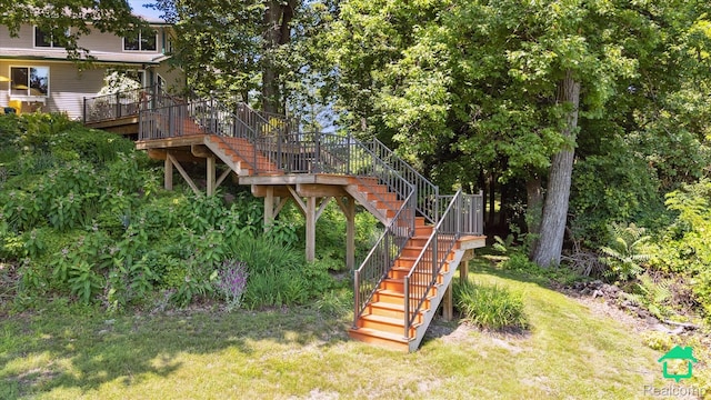2340 Lakeview Dr, Brooklyn, MI 49230 - view of green lawn with stairway and a deck