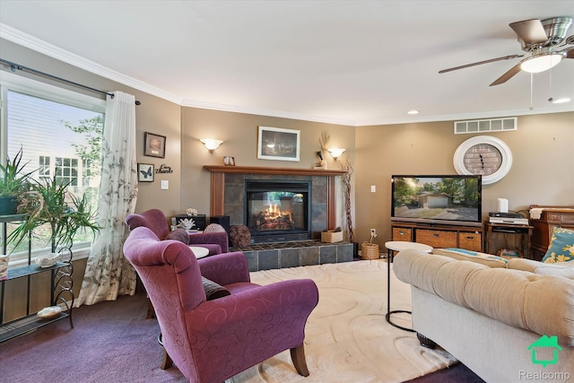 2340 Lakeview Dr, Brooklyn, MI 49230 - living area with ornamental molding, carpet, a fireplace, and a ceiling fan