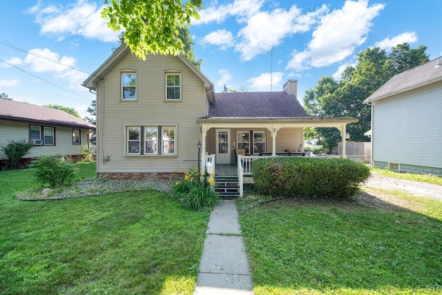 216 Budlong St, Adrian, MI 49221 - traditional-style home featuring a front yard, a porch, a chimney, and a shingled roof