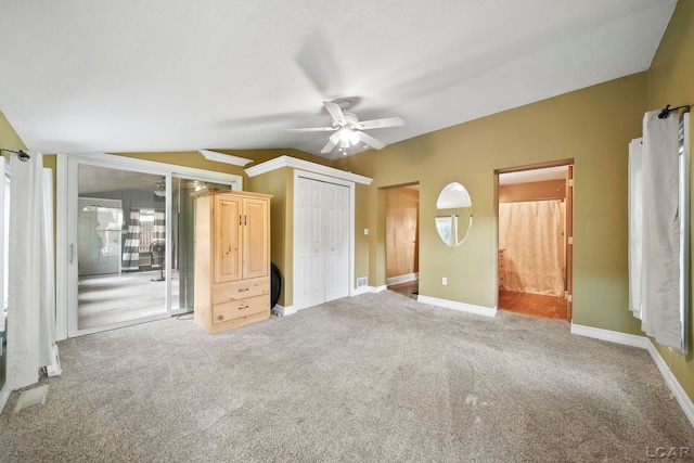 216 Budlong St, Adrian, MI 49221 - unfurnished bedroom with vaulted ceiling, carpet, a ceiling fan, and connected bathroom
