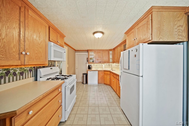 216 Budlong St, Adrian, MI 49221 - kitchen featuring white appliances, light countertops, and an ornate ceiling