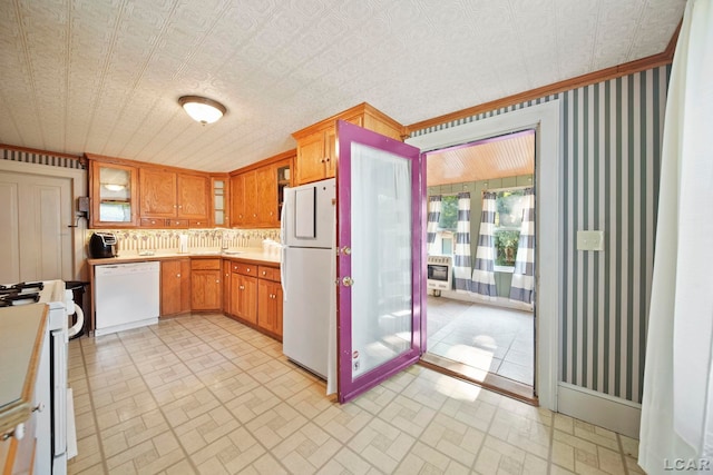 216 Budlong St, Adrian, MI 49221 - kitchen featuring white appliances, light countertops, brick patterned flooring, glass insert cabinets, and an ornate ceiling