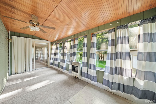 216 Budlong St, Adrian, MI 49221 - unfurnished sunroom featuring heating unit, lofted ceiling, wood ceiling, a ceiling fan, and tile patterned flooring
