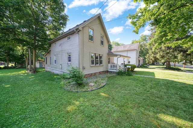 216 Budlong St, Adrian, MI 49221 - view of side of home featuring a lawn
