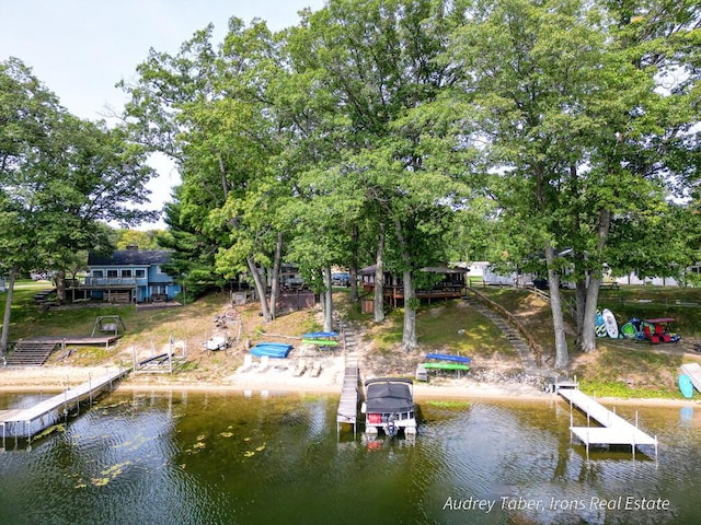 5190 N Bass Lake Rd, Irons, MI 49644 - dock area featuring a deck with water view