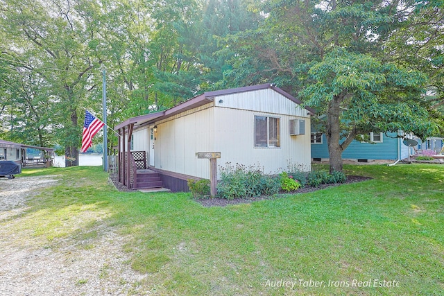 5190 N Bass Lake Rd, Irons, MI 49644 - view of property exterior with a lawn