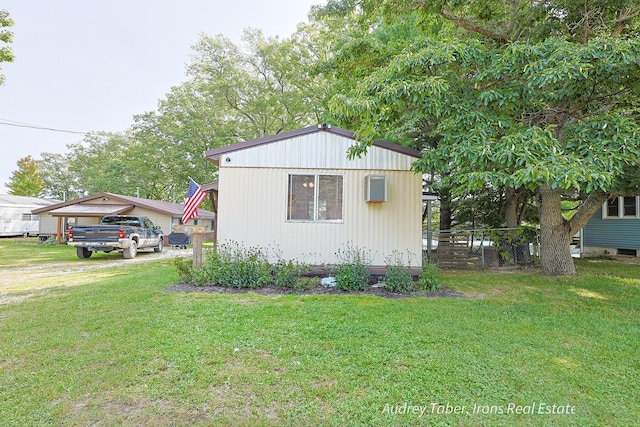 5190 N Bass Lake Rd, Irons, MI 49644 - view of side of property featuring a lawn