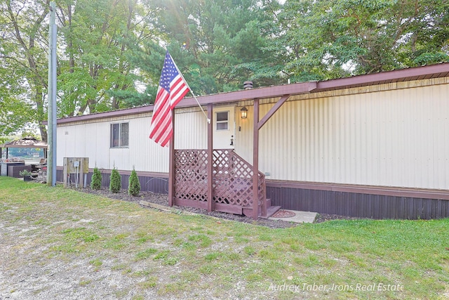 5190 N Bass Lake Rd, Irons, MI 49644 - manufactured / mobile home with a front yard