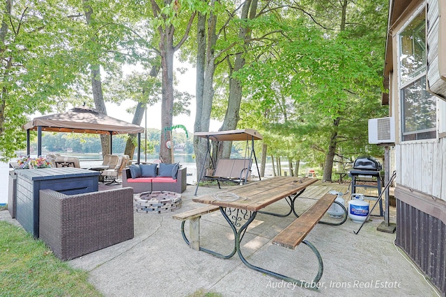 5190 N Bass Lake Rd, Irons, MI 49644 - view of patio featuring a gazebo, an outdoor living space with a fire pit, and a grill