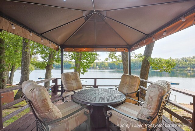 5190 N Bass Lake Rd, Irons, MI 49644 - dock featuring a water view and a gazebo