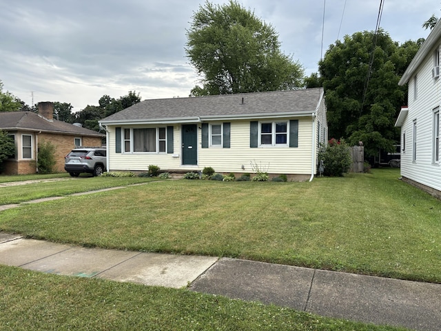 221 N Lakeview Ave, Sturgis, MI 49091 - view of front of property featuring a front yard and roof with shingles