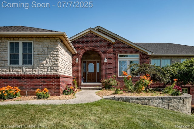 15946 Tubspring Rd, Allenton, MI 48002 - view of front facade with brick siding, a front lawn, roof with shingles, and stone siding