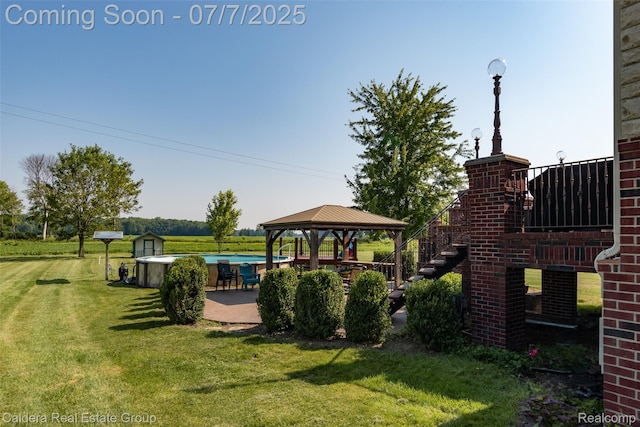 15946 Tubspring Rd, Allenton, MI 48002 - view of grassy yard featuring a gazebo, a patio, an outdoor pool, and stairway
