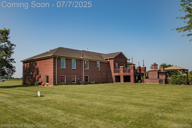 15946 Tubspring Rd, Allenton, MI 48002 - back of house featuring brick siding, a gazebo, and a yard