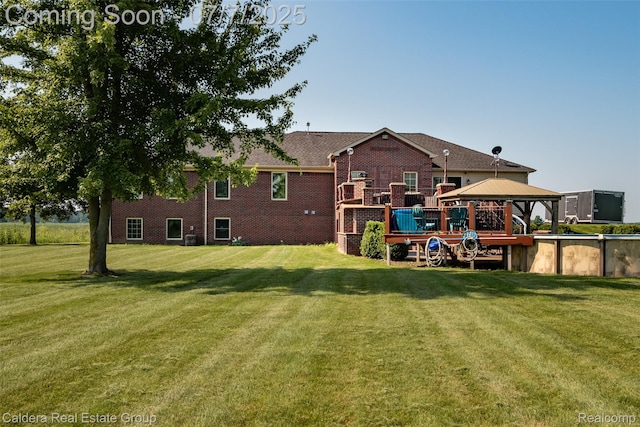 15946 Tubspring Rd, Allenton, MI 48002 - back of house with a gazebo, a yard, and brick siding