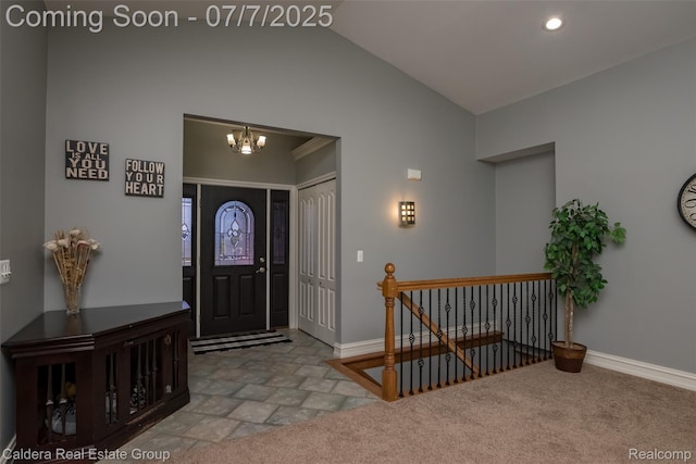 15946 Tubspring Rd, Allenton, MI 48002 - entrance foyer with vaulted ceiling, a chandelier, stone finish floors, and recessed lighting