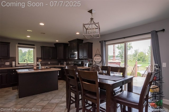15946 Tubspring Rd, Allenton, MI 48002 - dining room with recessed lighting and a chandelier