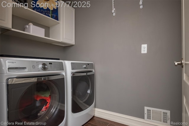 15946 Tubspring Rd, Allenton, MI 48002 - laundry room featuring cabinet space, washer and dryer, and dark wood-style flooring