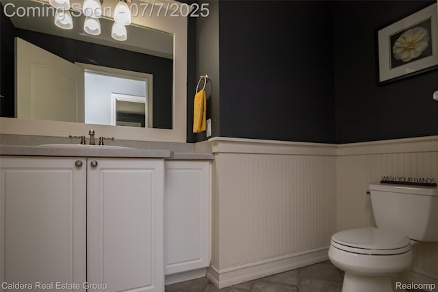 15946 Tubspring Rd, Allenton, MI 48002 - bathroom with a wainscoted wall, vanity, and tile patterned flooring