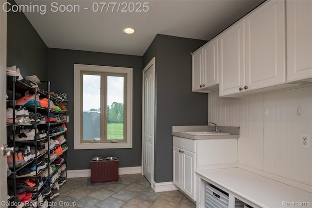15946 Tubspring Rd, Allenton, MI 48002 - laundry area featuring recessed lighting and light stone finish flooring