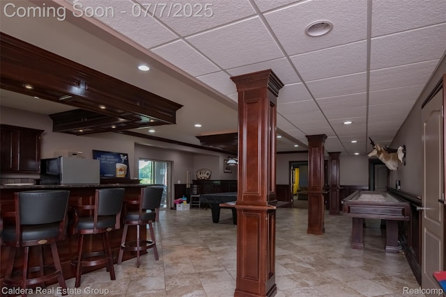 15946 Tubspring Rd, Allenton, MI 48002 - recreation room featuring decorative columns, a bar, a paneled ceiling, and recessed lighting
