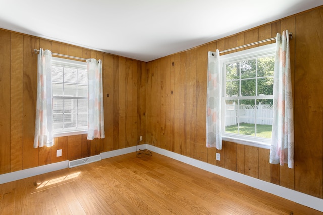 1200 Orchard Ave, Saint Joseph, MI 49085 - spare room featuring wood finished floors and wood walls