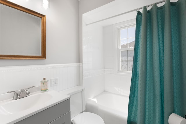 1200 Orchard Ave, Saint Joseph, MI 49085 - bathroom with vanity, shower / bath combo with shower curtain, and a wainscoted wall