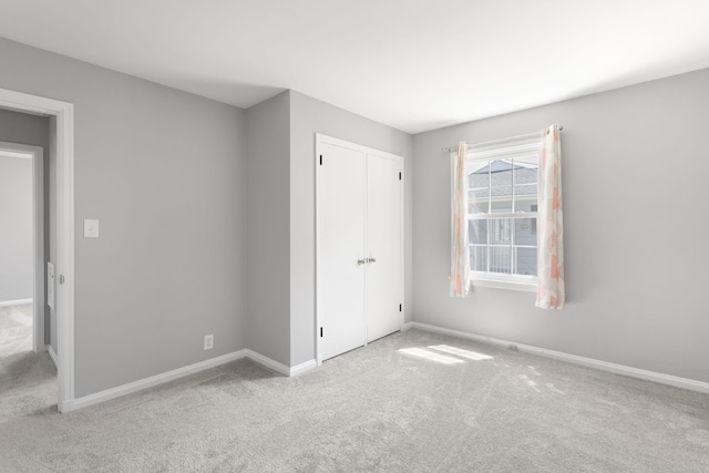 1200 Orchard Ave, Saint Joseph, MI 49085 - unfurnished bedroom featuring carpet and a closet