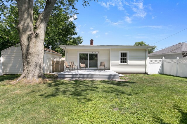1200 Orchard Ave, Saint Joseph, MI 49085 - back of property with a chimney and a deck