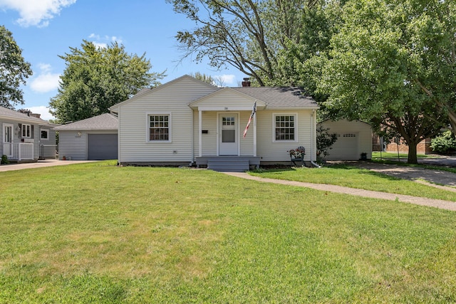 1200 Orchard Ave, Saint Joseph, MI 49085 - view of front of house featuring a garage, concrete driveway, a front yard, and a chimney