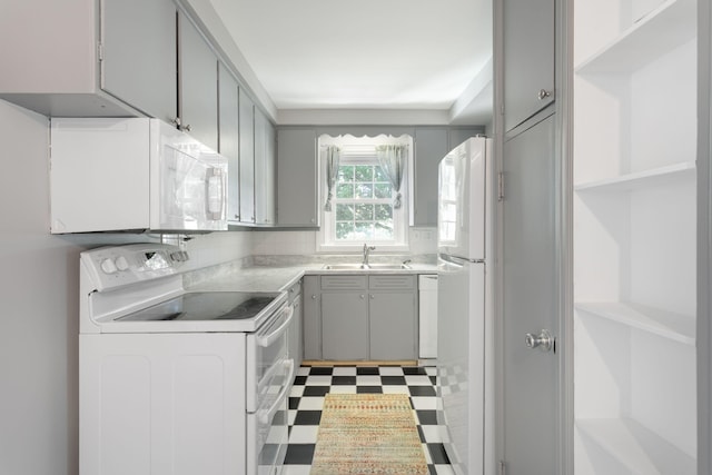 1200 Orchard Ave, Saint Joseph, MI 49085 - kitchen featuring white appliances, gray cabinets, tile patterned floors, light countertops, and open shelves