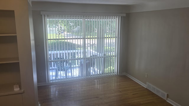 19969 Poinciana, Redford, MI 48240 - unfurnished room with wood finished floors and baseboards