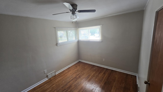 19969 Poinciana, Redford, MI 48240 - unfurnished room featuring ornamental molding, dark wood-style floors, and a ceiling fan