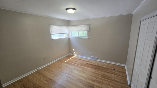 19969 Poinciana, Redford, MI 48240 - unfurnished bedroom with wood finished floors, a closet, and ornamental molding