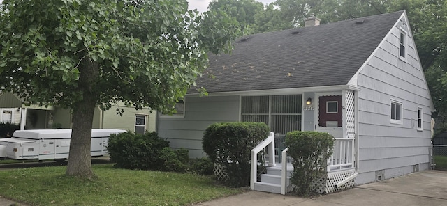 19969 Poinciana, Redford, MI 48240 - view of front of property featuring a shingled roof, a chimney, a front yard, and crawl space