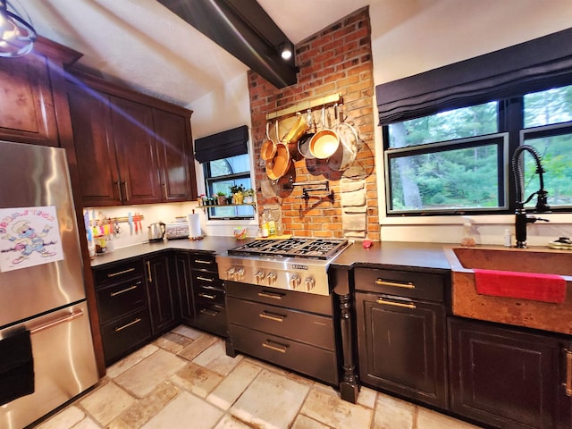 241 Dale St, Grayling, MI 49738 - kitchen featuring stainless steel appliances, stone tile flooring, and dark countertops