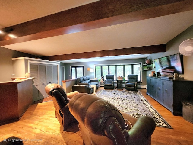 241 Dale St, Grayling, MI 49738 - living area with beamed ceiling and light wood-style flooring