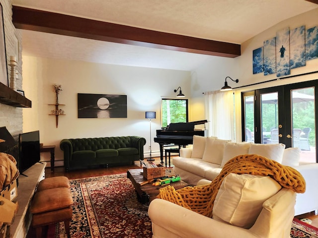 241 Dale St, Grayling, MI 49738 - living room featuring beam ceiling, french doors, healthy amount of natural light, wood finished floors, and a fireplace