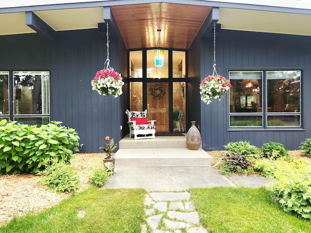 241 Dale St, Grayling, MI 49738 - view of exterior entry featuring covered porch