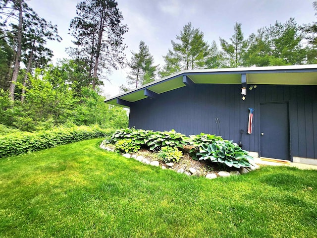 241 Dale St, Grayling, MI 49738 - view of side of home with a yard
