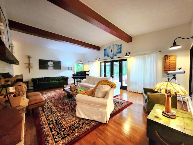 241 Dale St, Grayling, MI 49738 - living area featuring beam ceiling, light wood-style floors, and a fireplace