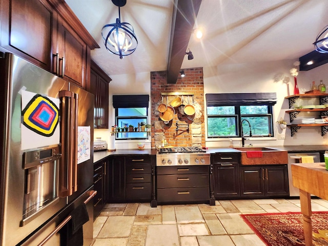 241 Dale St, Grayling, MI 49738 - kitchen with appliances with stainless steel finishes, stone tile floors, and a chandelier