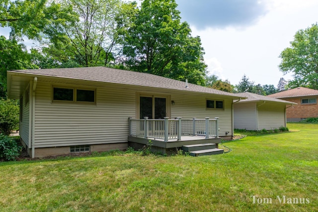 7131 Windcrest St SE, Grand Rapids, MI 49546 - back of house with a wooden deck and a lawn
