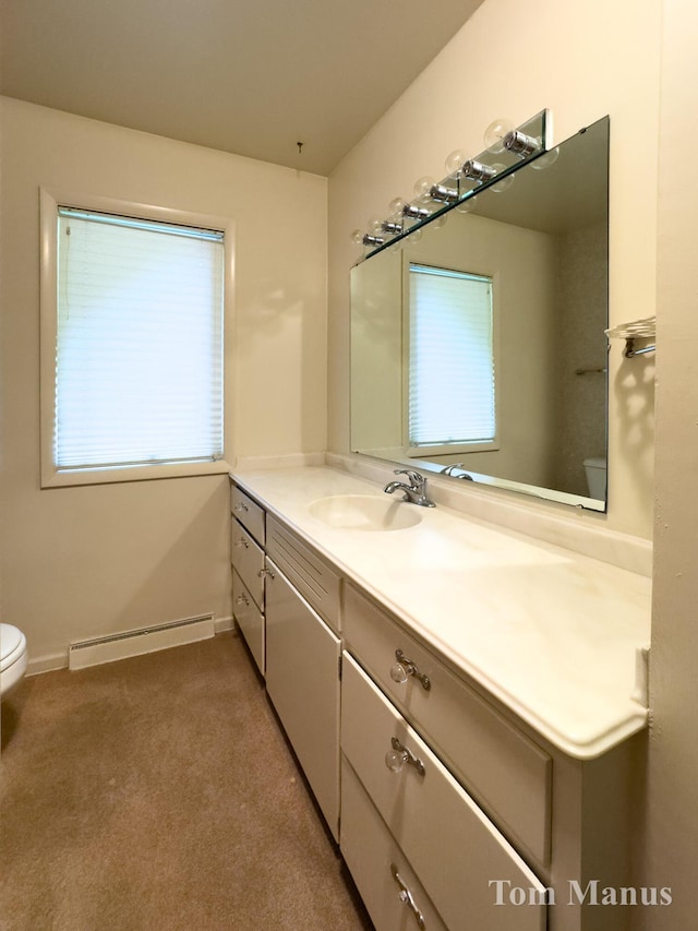 7131 Windcrest St SE, Grand Rapids, MI 49546 - half bathroom with a baseboard heating unit and vanity